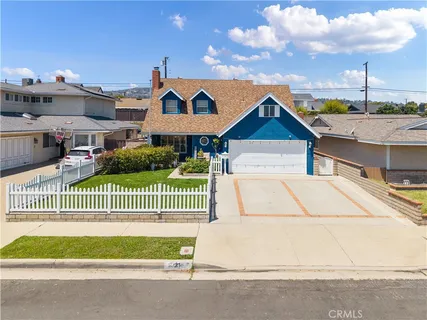 a view of a house with a street