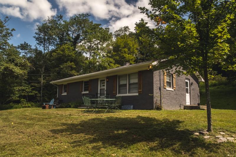 401 Sawmill Road Southwest Willis, VA 24380 - Photo 1 of 31 a front view of house with yard and trees