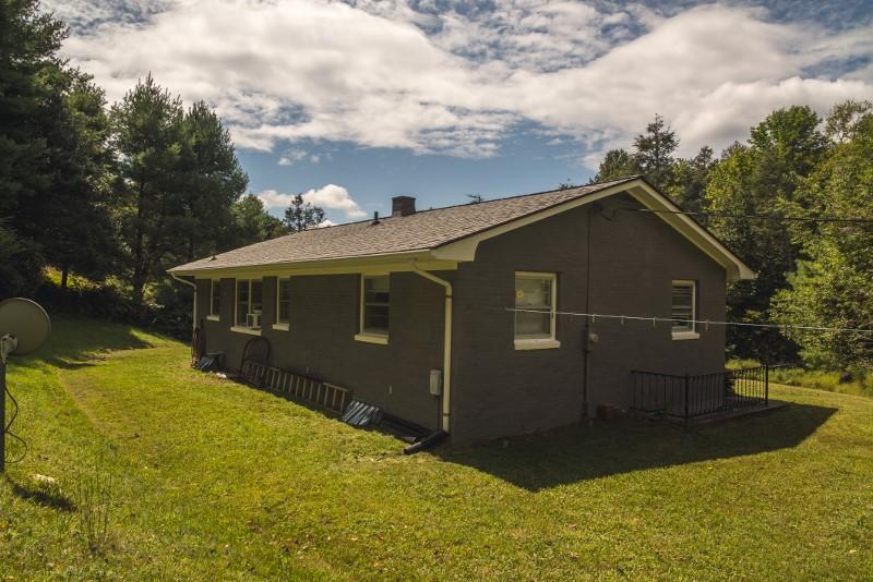 401 Sawmill Road Southwest Willis, VA 24380 - Photo 21 of 31 a front view of house with yard