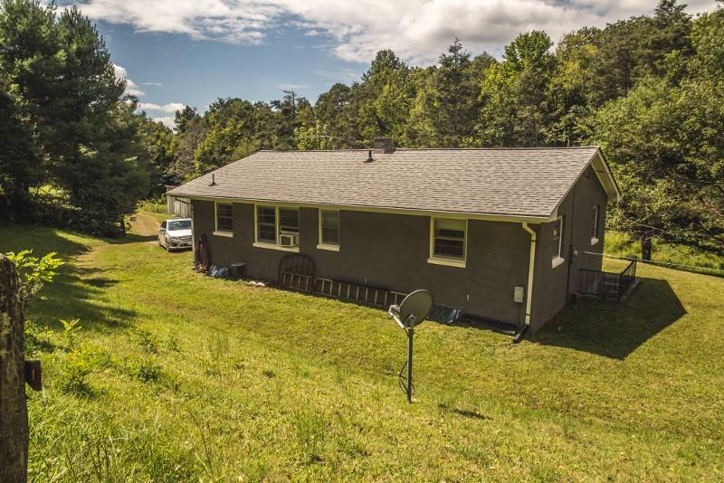 401 Sawmill Road Southwest Willis, VA 24380 - Photo 22 of 31 a front view of a house with a yard