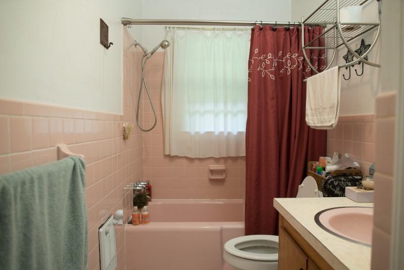 401 Sawmill Road Southwest Willis, VA 24380 - Photo 25 of 31 a bathroom with a sink a toilet and shower