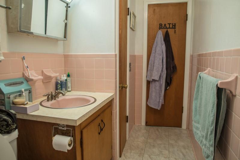 401 Sawmill Road Southwest Willis, VA 24380 - Photo 26 of 31 a bathroom with a sink and a mirror