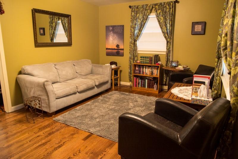 401 Sawmill Road Southwest Willis, VA 24380 - Photo 29 of 31 a living room with furniture a large window and a flat screen tv