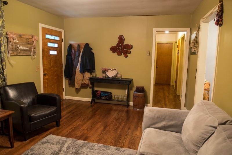 401 Sawmill Road Southwest Willis, VA 24380 - Photo 30 of 31 a living room with furniture and wooden floor