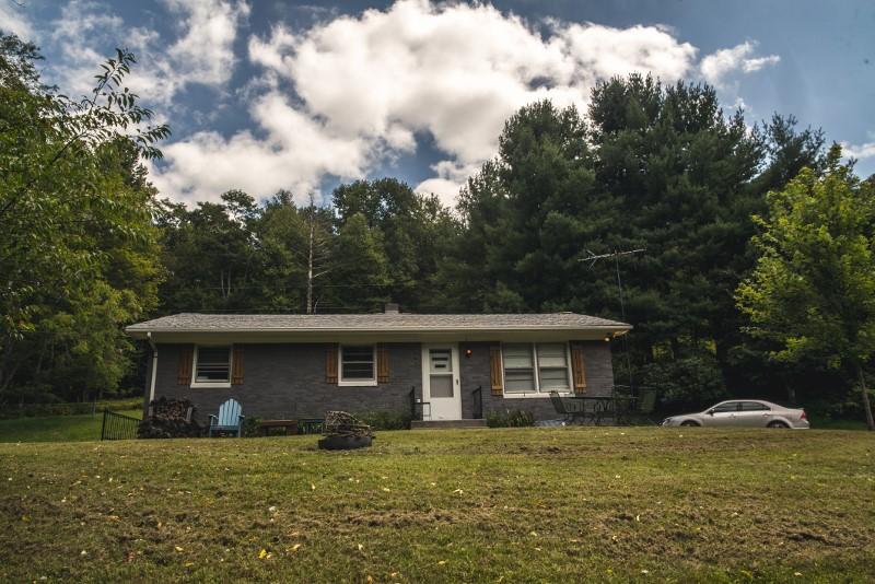 401 Sawmill Road Southwest Willis, VA 24380 - Photo 5 of 31 a view of a house with a yard