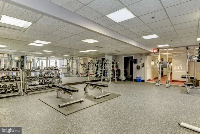 a living room with furniture a pool table and a window