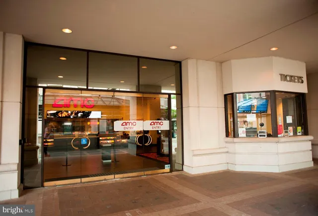 a view of a building with car parked