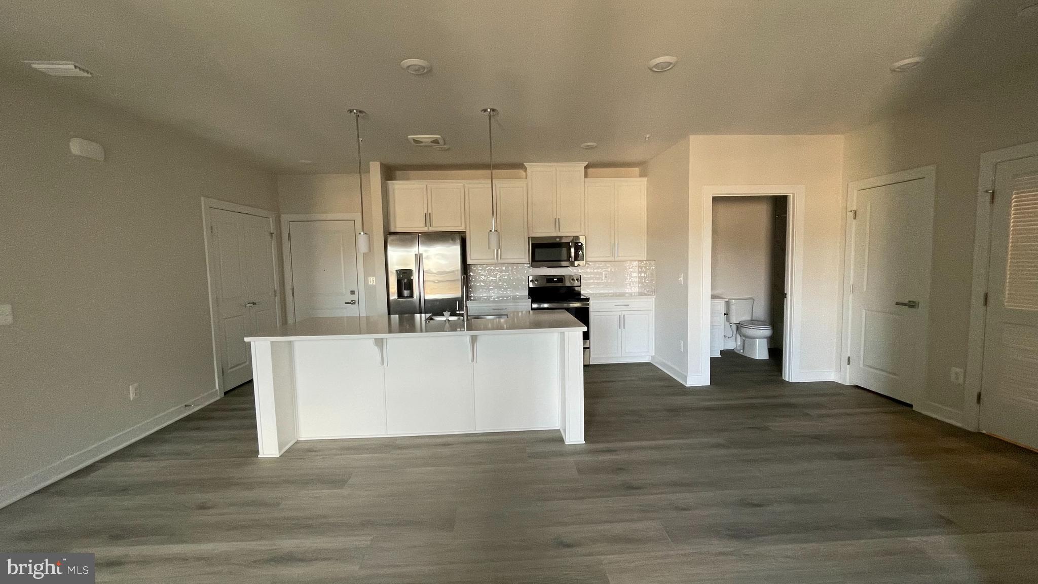 12865 Mosaic Pk Way, Unit M Herndon, VA 20171 - Photo 1 of 18 a view of kitchen with wooden floor