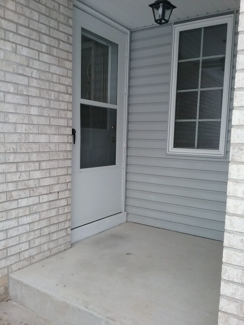 2208 Root Street Crest Hill, IL 60403 - Photo 2 of 21 a view of front door and a window
