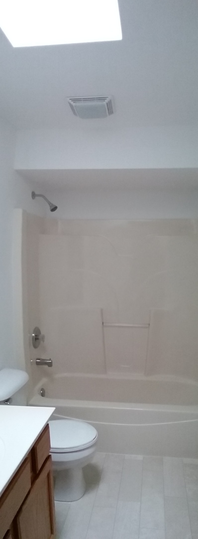 2208 Root Street Crest Hill, IL 60403 - Photo 15 of 21 a bathroom with a shower a toilet and sink