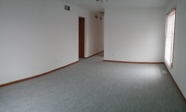 2208 Root Street Crest Hill, IL 60403 - Photo 5 of 21 a view of a room that has a window in it