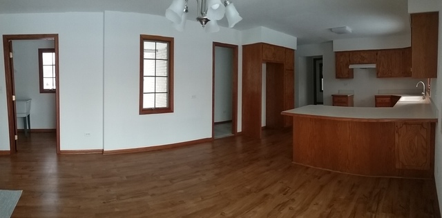 2208 Root Street Crest Hill, IL 60403 - Photo 7 of 21 an empty room with wooden floor and windows