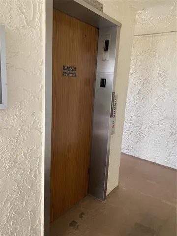 a sign that is on the wall of the building