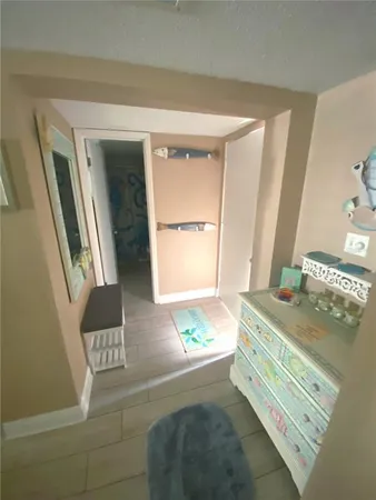 a bedroom with a bed and a mirror