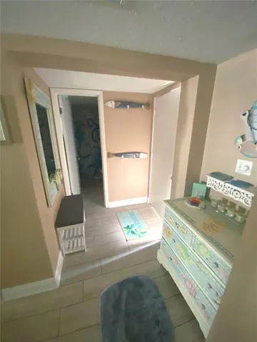 a bedroom with a bed and a mirror