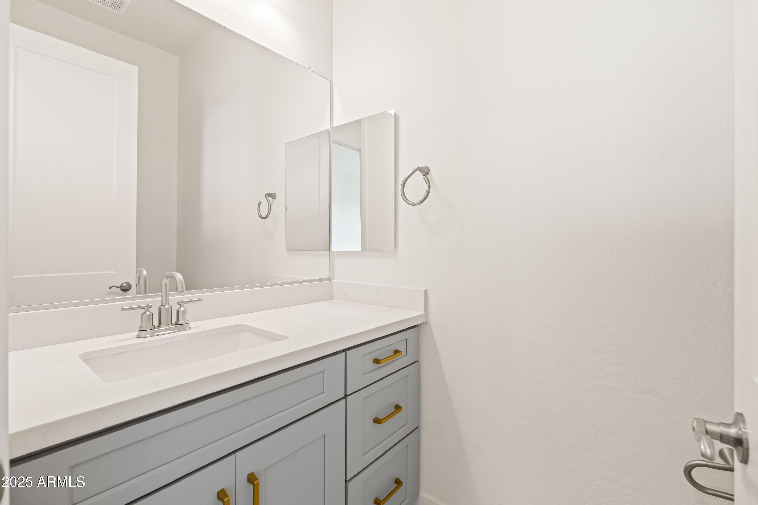 3 North Brenner Pass Road, Unit E3 Queen Creek, AZ 85144 - Photo 11 of 88 2h guest half bathroom