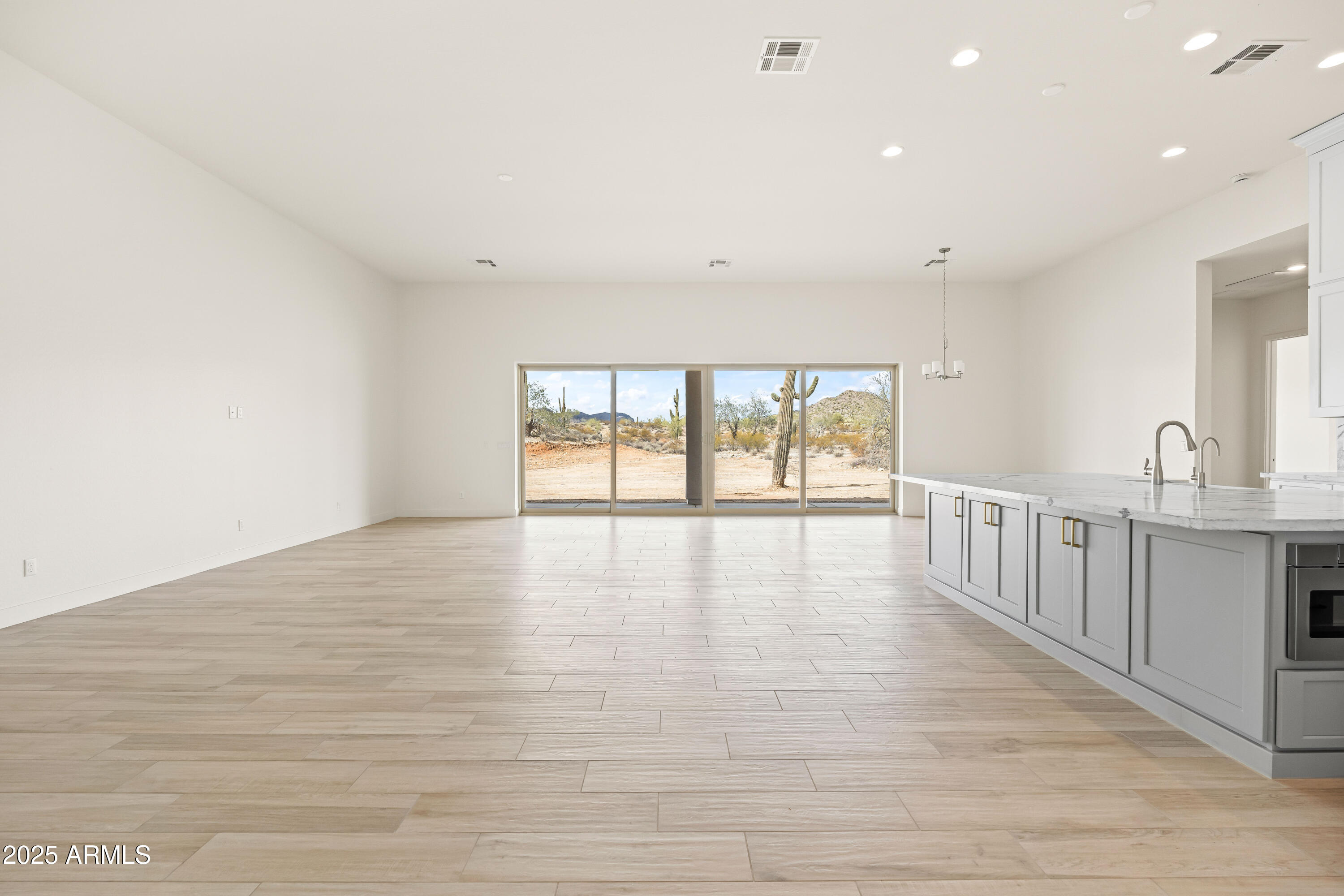 3 North Brenner Pass Road, Unit E3 Queen Creek, AZ 85144 - Photo 12 of 88 3a family room & kitchen split