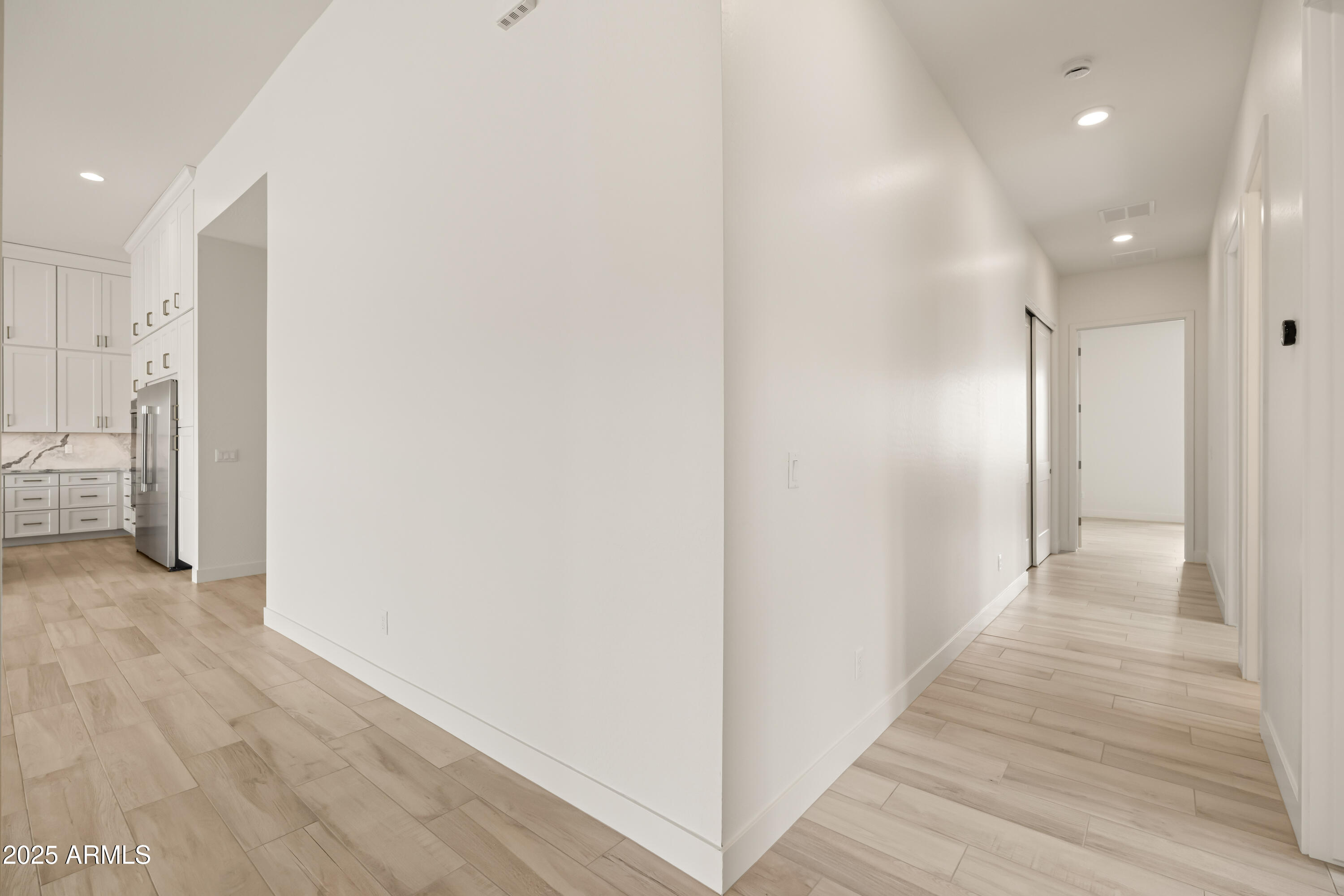 3 North Brenner Pass Road, Unit E3 Queen Creek, AZ 85144 - Photo 57 of 88 5 guest bedroom hallway & family room sp