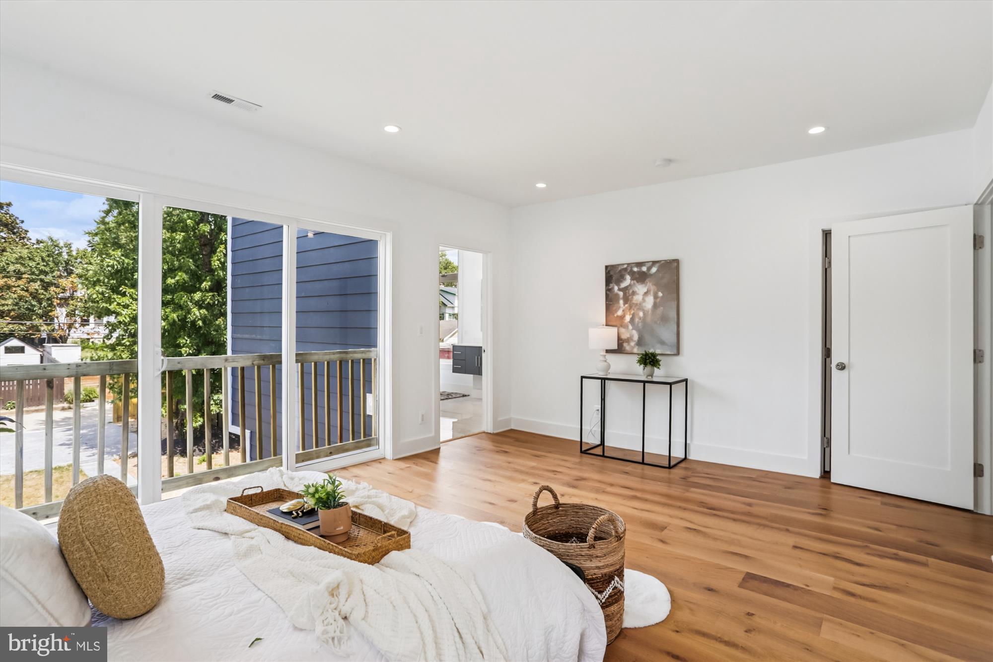 1341 Ingraham Street Northwest Washington, DC 20011 - Photo 21 of 51 a bedroom with a bed and wooden floor