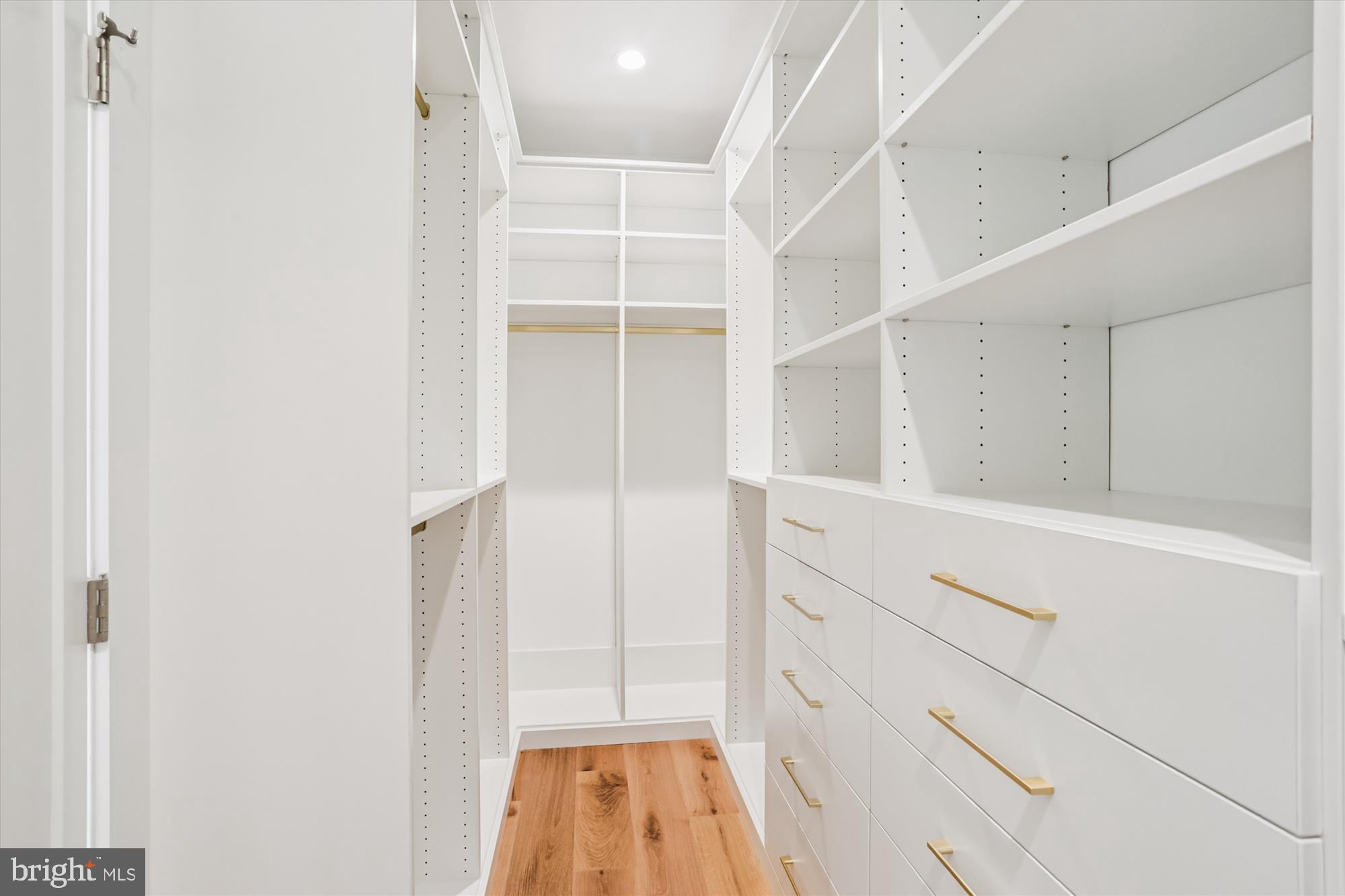 1341 Ingraham Street Northwest Washington, DC 20011 - Photo 26 of 51 a view of walk in closet with empty racks