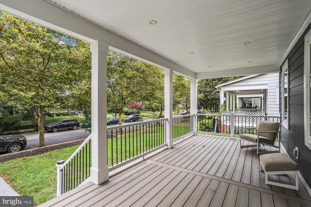 a view of a house with wooden deck