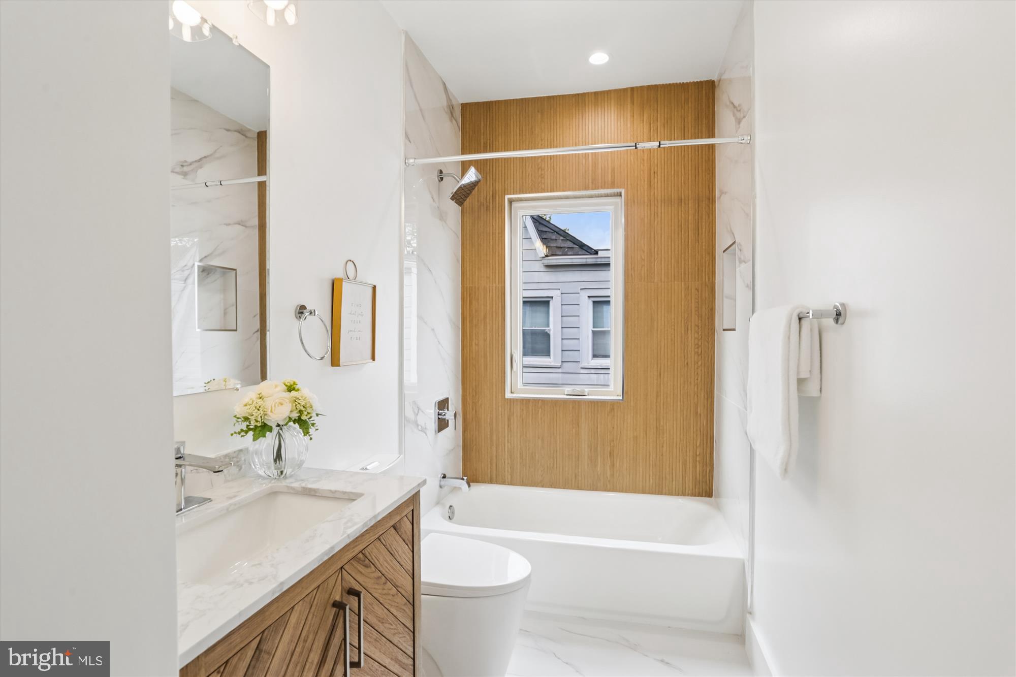 1341 Ingraham Street Northwest Washington, DC 20011 - Photo 31 of 51 a bathroom with a granite countertop sink a toilet and shower