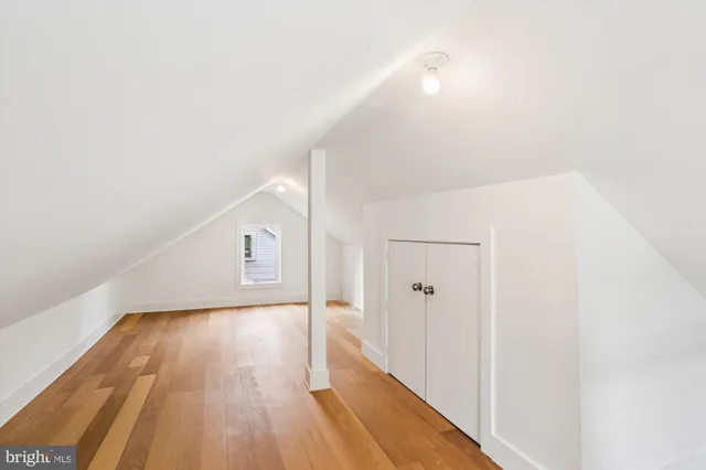 a view of hallway with wooden floor