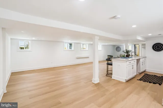 a view of kitchen with wooden floor and electronic appliances