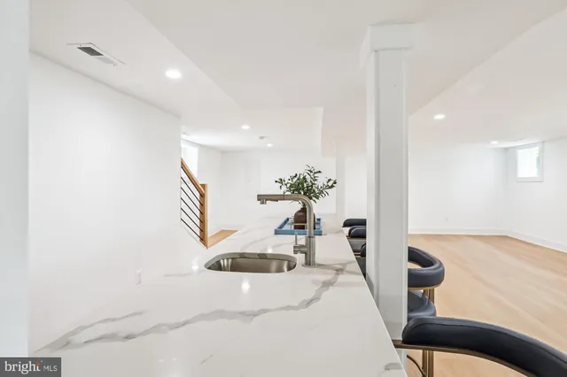 a view of a living room and a potted plant