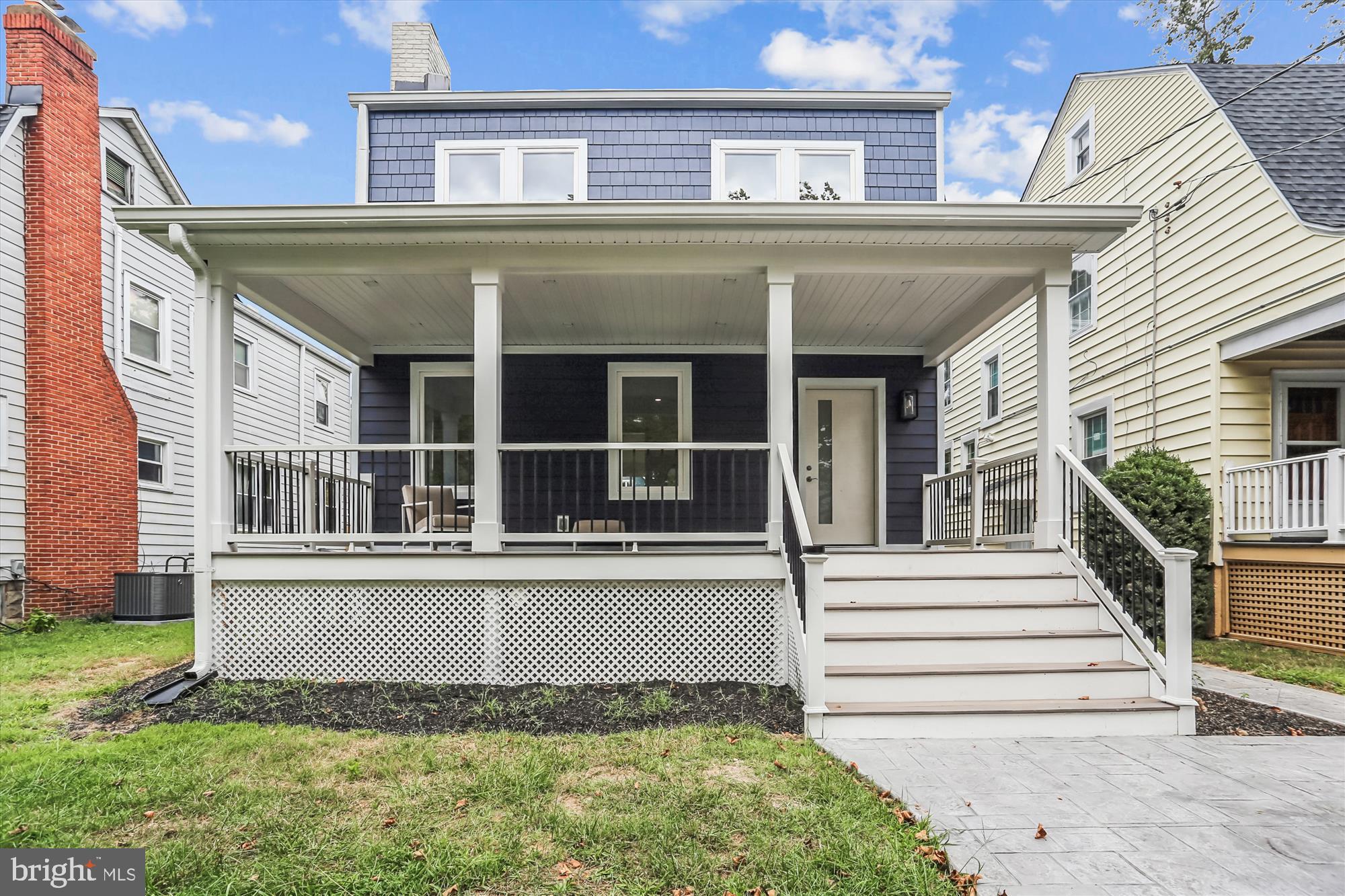 1341 Ingraham Street Northwest Washington, DC 20011 - Photo 42 of 51 front view of a house with a small yard
