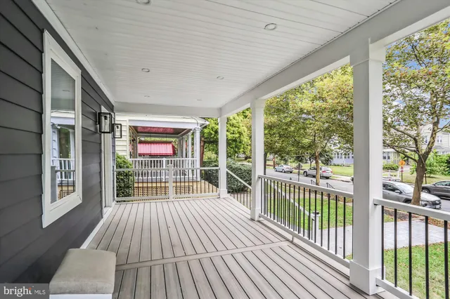 a view of a balcony with wooden floor
