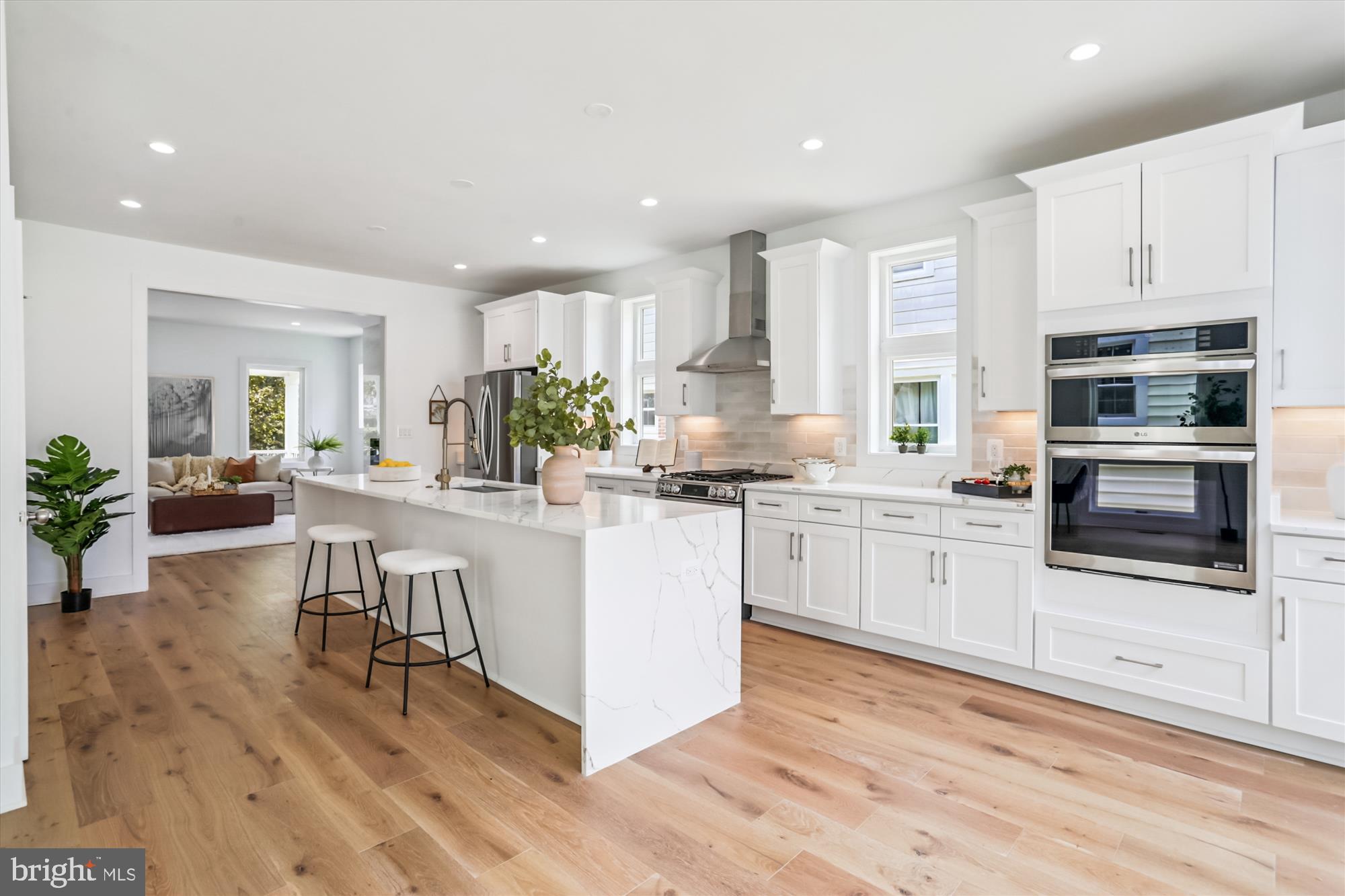 1341 Ingraham Street Northwest Washington, DC 20011 - Photo 10 of 51 a kitchen with white cabinets and appliances