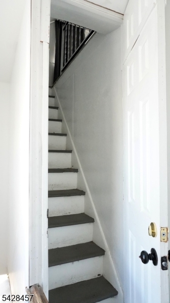 1007 Julia Street Elizabeth, NJ 07201 - Photo 15 of 20 a view of staircase with railing and white walls