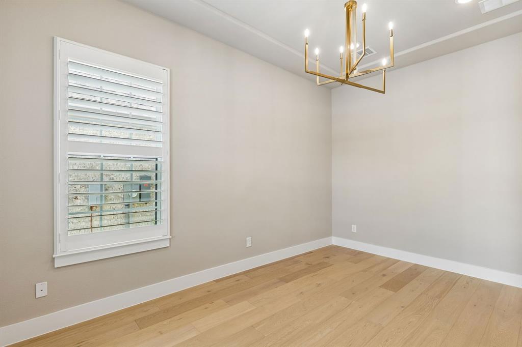 4512 Meander Way Prosper, TX 75078 - Photo 23 of 40 wooden floor in an empty room with a window