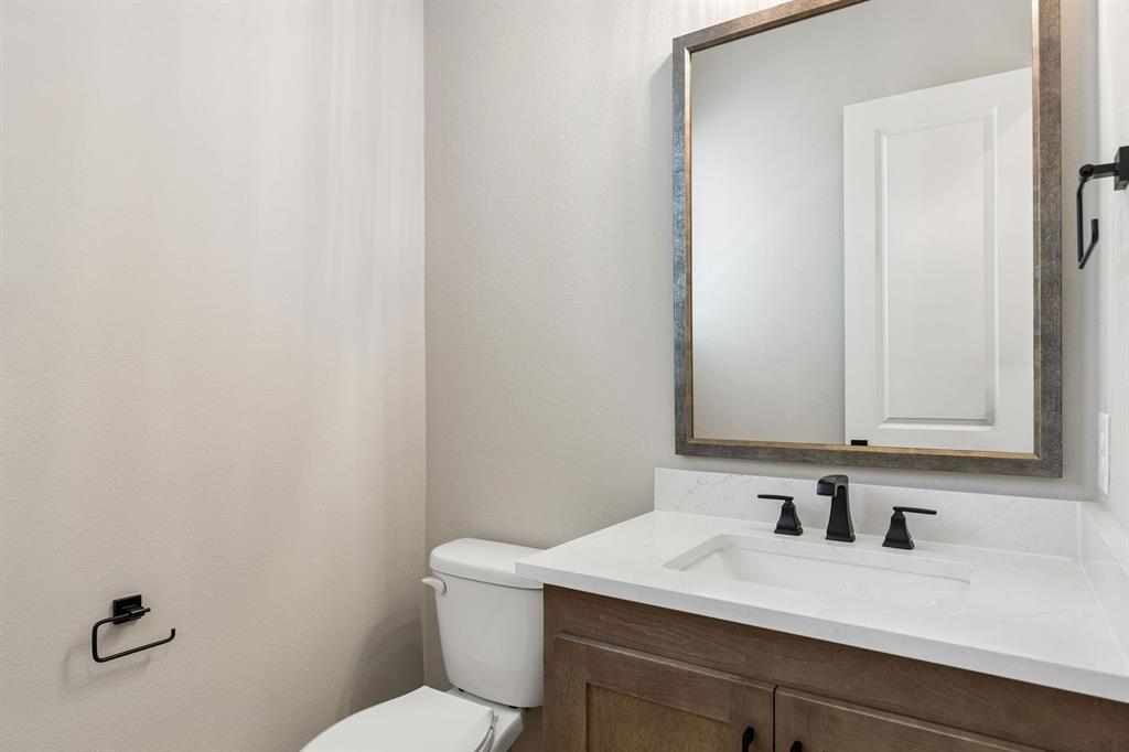 4512 Meander Way Prosper, TX 75078 - Photo 27 of 40 a bathroom with a sink and a toilet
