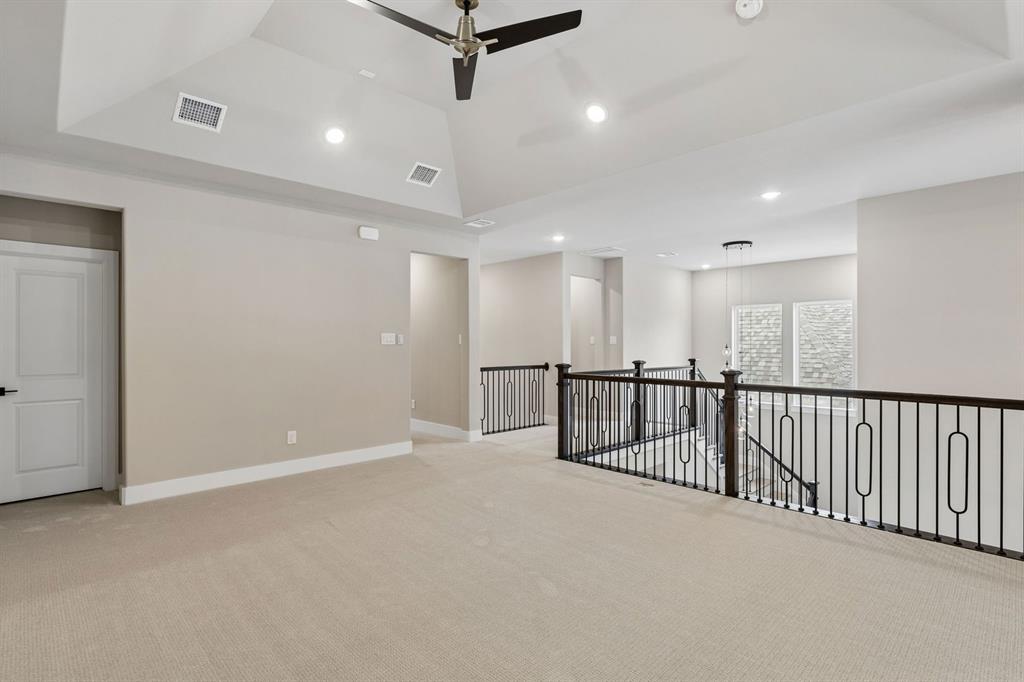 4512 Meander Way Prosper, TX 75078 - Photo 30 of 40 a view of an empty room with wooden floor