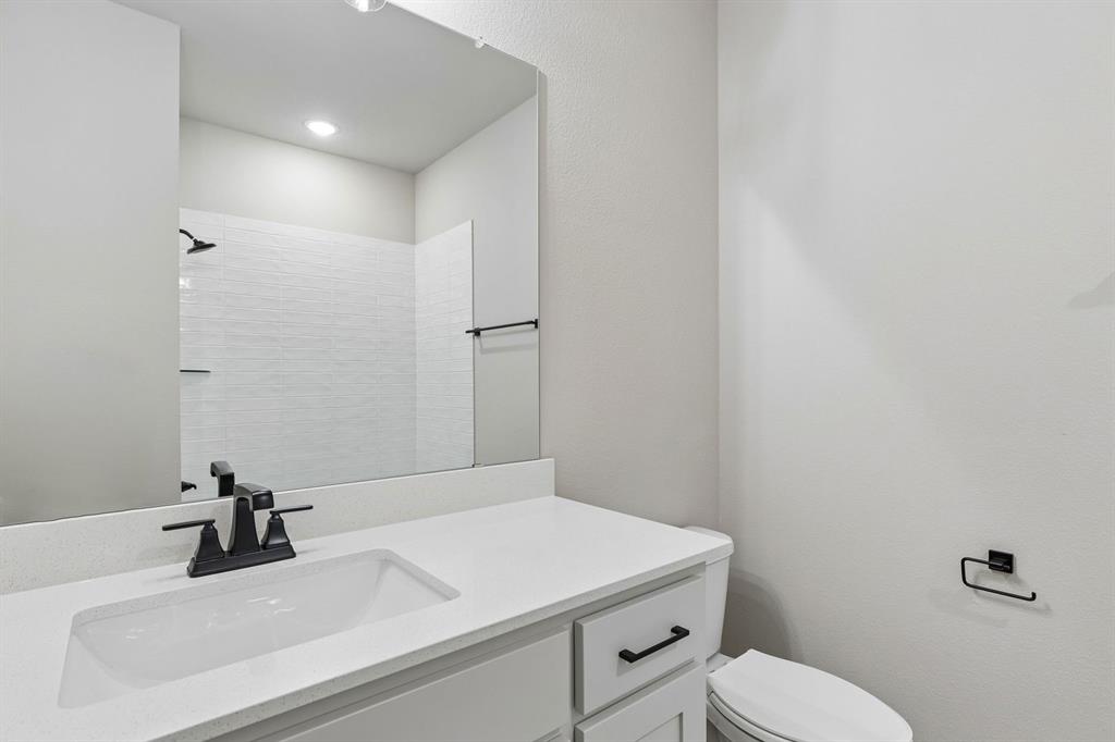 4512 Meander Way Prosper, TX 75078 - Photo 31 of 40 a bathroom with a sink and a toilet