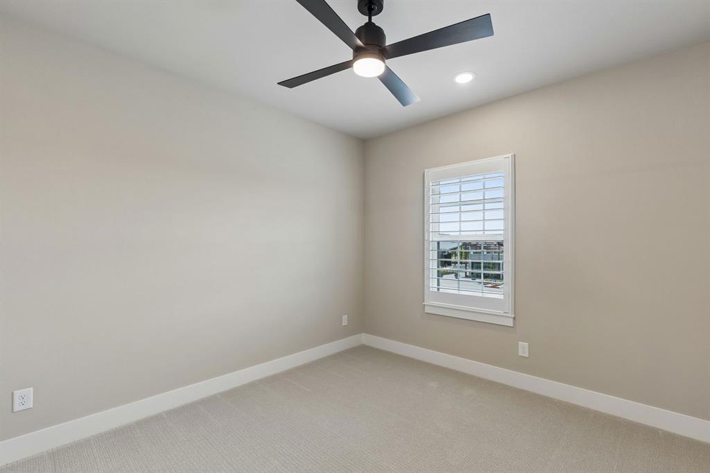 4512 Meander Way Prosper, TX 75078 - Photo 32 of 40 an empty room with a window and a fan