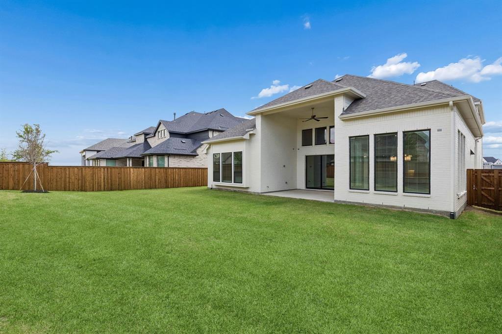 4512 Meander Way Prosper, TX 75078 - Photo 36 of 40 a view of a house with a backyard