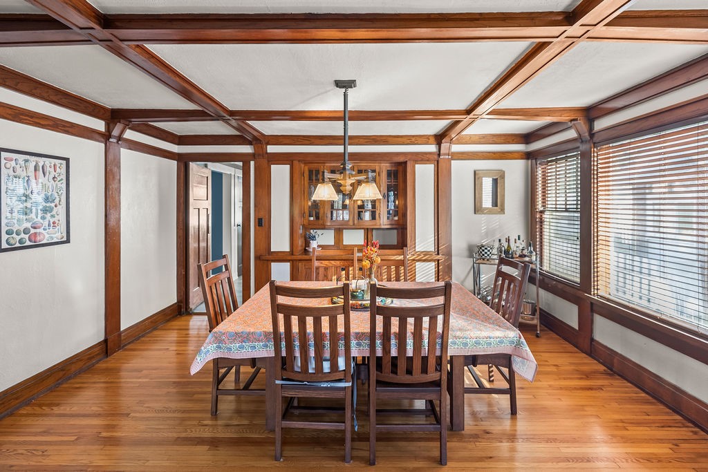 176 North Taylor Avenue Decatur, IL 62522 - Photo 11 of 45 a dining room with wooden floor a chandelier a glass table and chairs