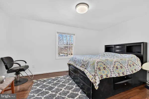 a bedroom with a bed and dresser