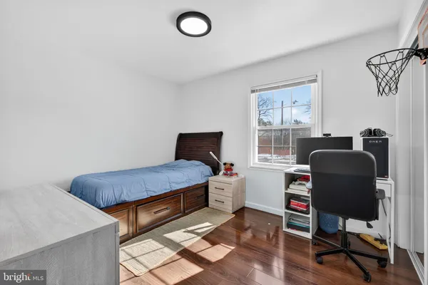 a bedroom with furniture and a window