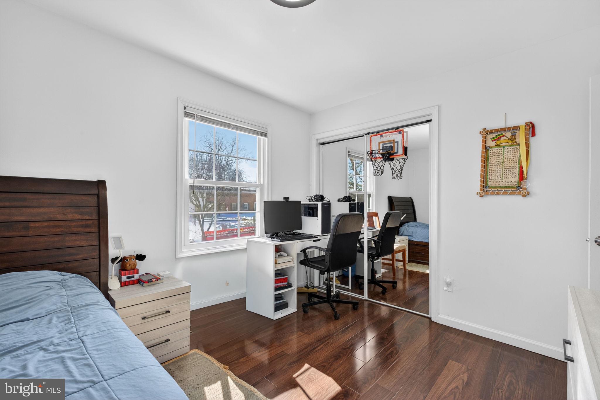 8526 Forrester Boulevard, Unit 890 Springfield, VA 22152 - Photo 21 of 24 a living room with furniture and wooden floor