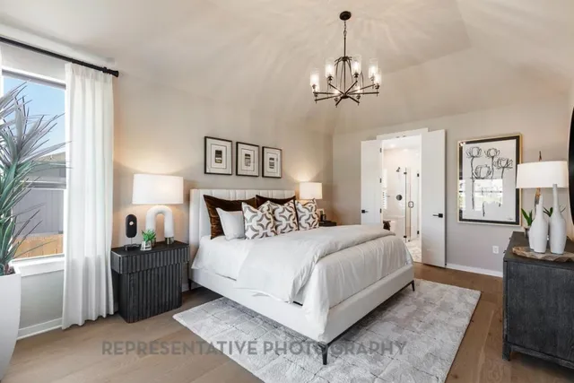 a bed room with a bed and a mirror