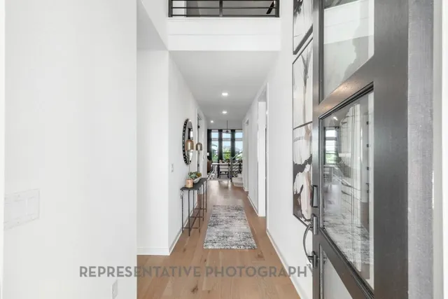 a view of a workspace with furniture and window
