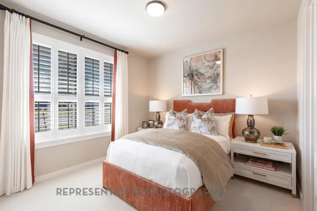 a living room with furniture potted plant and a window