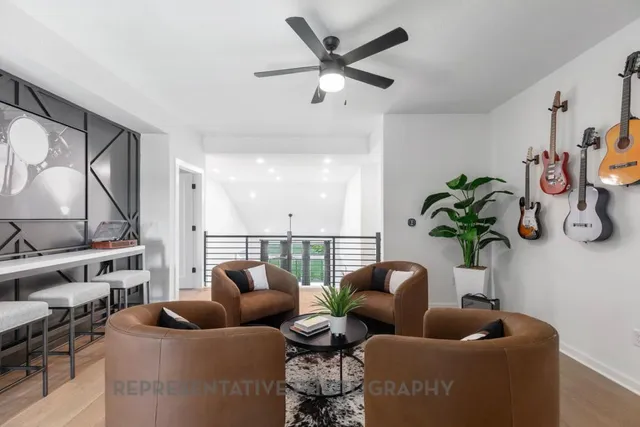 a living room with furniture and a potted plant