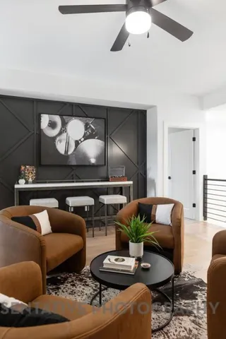 a living room with furniture and a rug