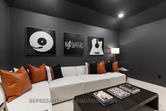 a living room with furniture and a flat screen tv