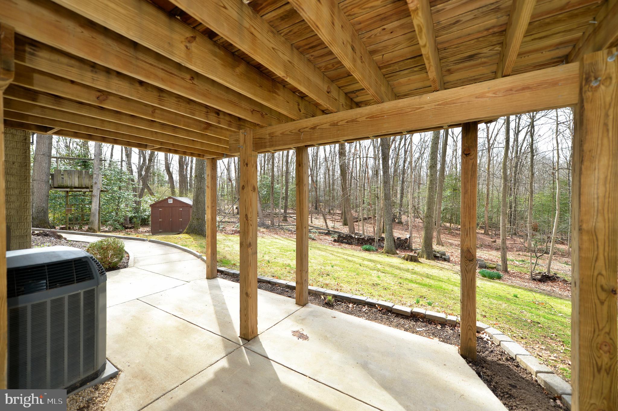 11403 Running Cedar Road Reston, VA 20191 - Photo 11 of 58 Covered patio view of backyard and treed area
